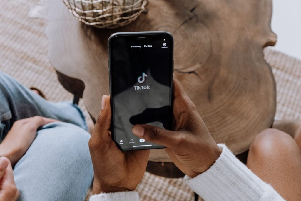 a person opening the TikTok app on their phone